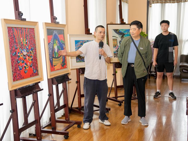 Painters presenting their original works at the salon